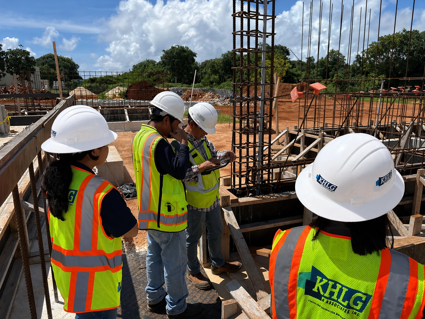 Project team reviewing construction plans on site